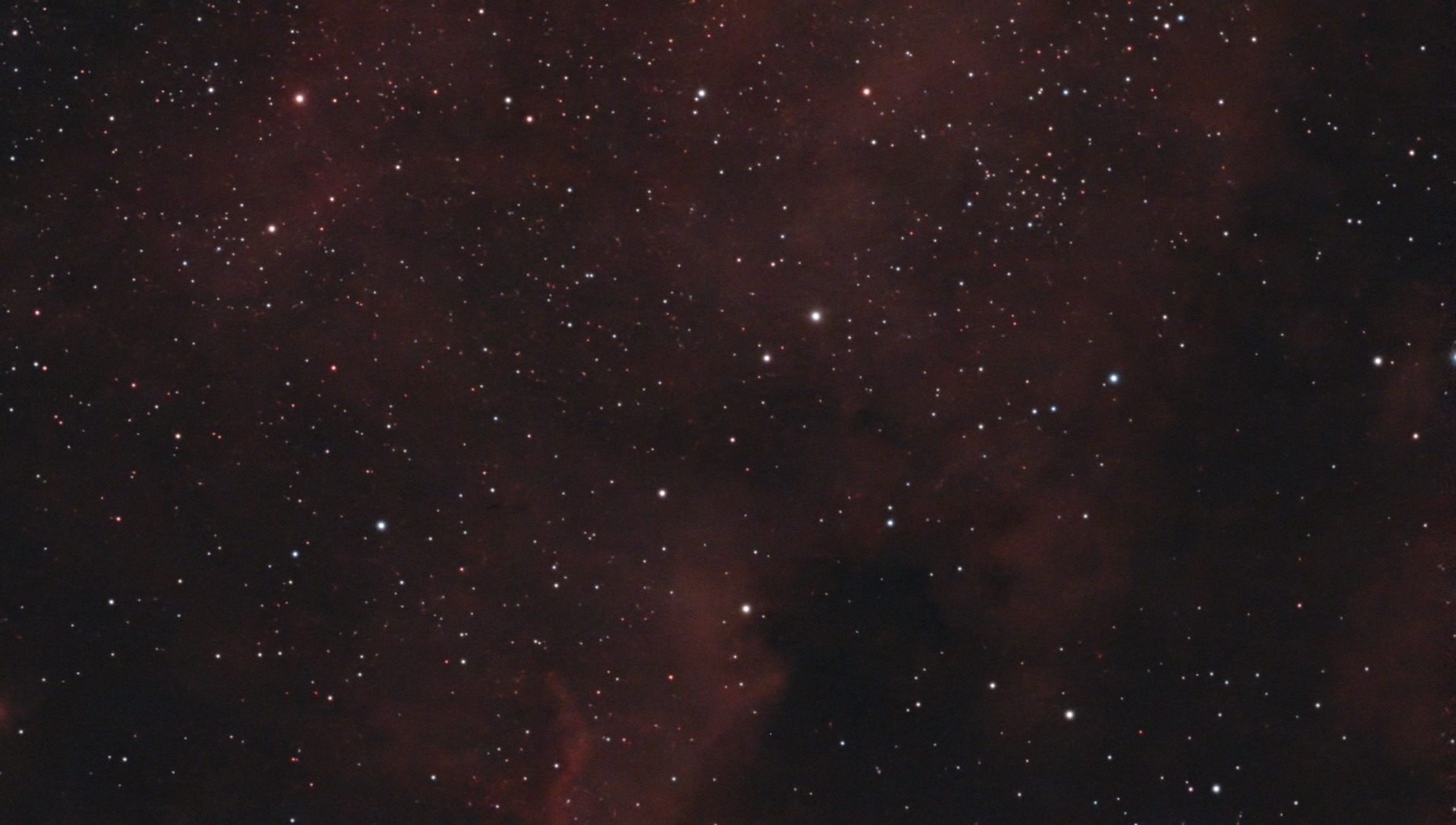 A red emission nebula among stars